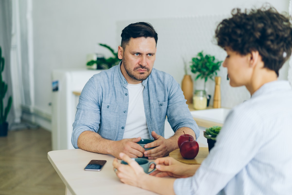 Nutritionist consulting with male client about healthy eating